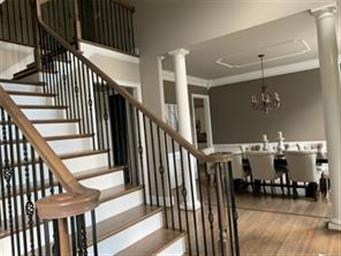 Step into the foyer with the magnificent staircase