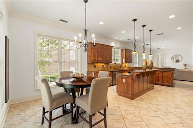 in Kitchen. Note island with breakfast bar
