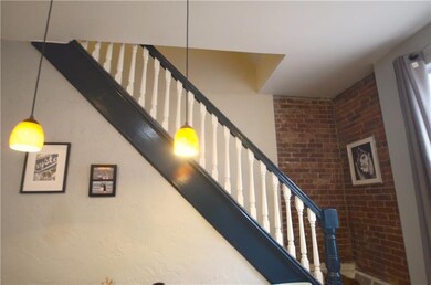 Beautifully restored staircase and exposed brick w