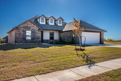 View of front of property with a garage and a fron