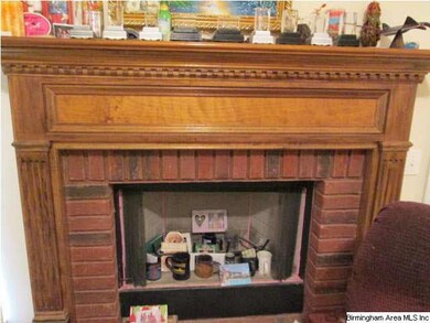 Fireplace with gas starter in Den/Family that has 