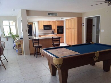 Wide shot kit dining & pool table