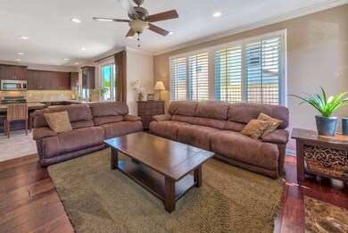 Adjoins kitchen and sliders to the patio