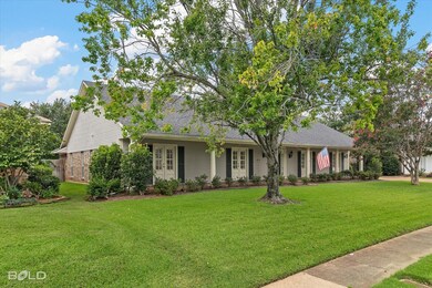 Ranch-style home featuring a front yard