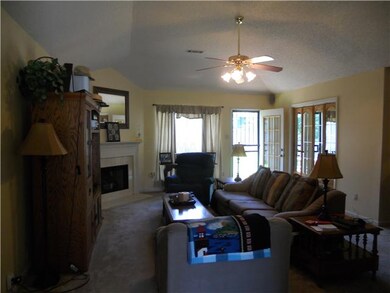 Spacious great room w/ corner fireplace as viewed 