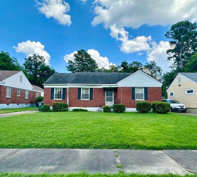 View of front of property with a front lawn