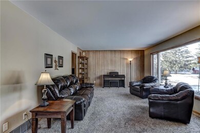 The sizable living room basked in sunlight from th
