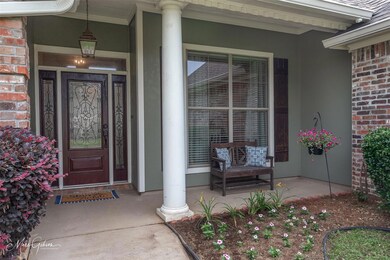 Entrance to property featuring covered porch