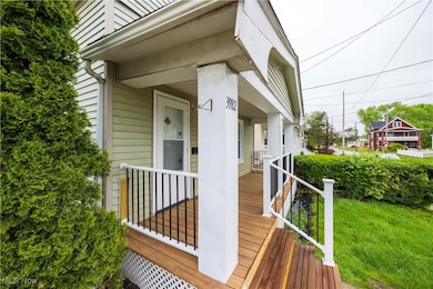 Wooden porch featuring a lawn