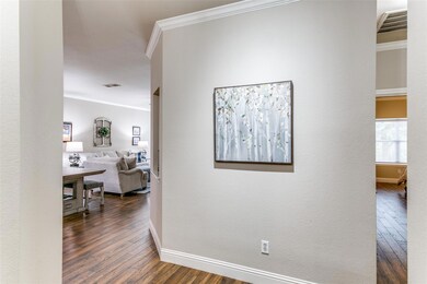 Hall with dark hardwood / wood-style flooring and 