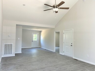 14x23 sqft of living area with vaulted ceiling.