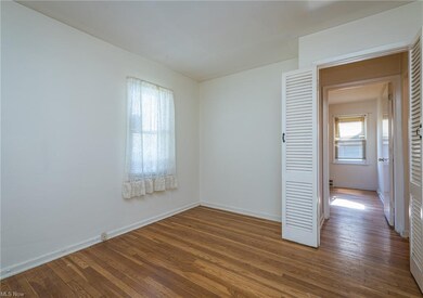 Bedroom 2 first floor with hardwood floors