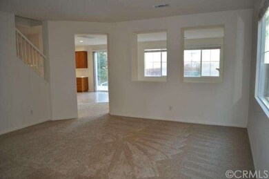 Spacious living room with newly installed carpet