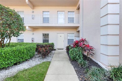Entrance to property with stucco siding