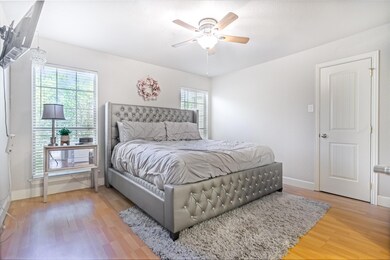 Bedroom with hardwood / wood-style flooring, ceili
