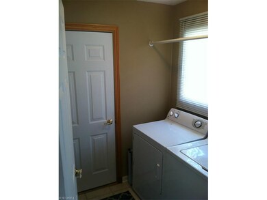Laundry room conveniently located between garage a