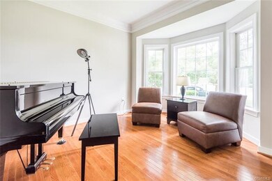 The living room has hardwood flooring, double crow