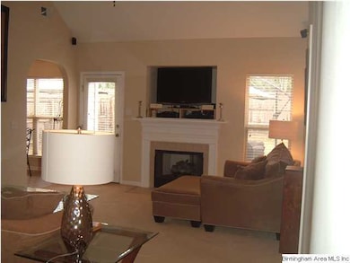 Large living room with vaulted ceiling and firepla