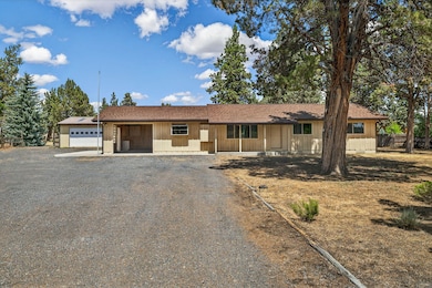 Front of Home with driveway to Barn and Shop