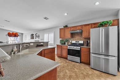 Kitchen featuring stainless steel appliances, ligh