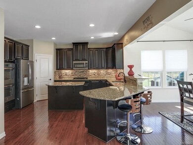 Hardwood floors, granite counters and island, buil