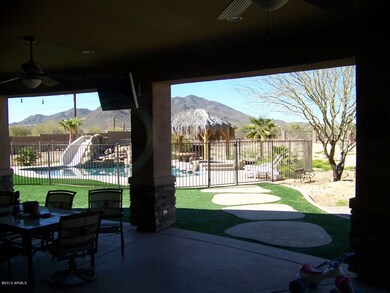 Full length covered patio and backyard