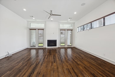 Living Room.  Double doors open onto a private cov