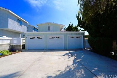 Large driveway with three car garage