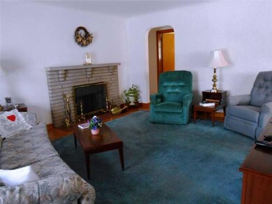 Living Room. A deco stone fireplace is a welcoming