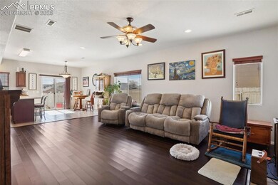 Living area featuring wood-type flooring, visible 