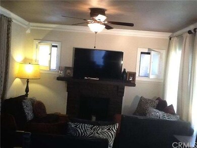 SPACIOUS FAMILY ROOM WITH ORIGINAL CROWN MOLDING &