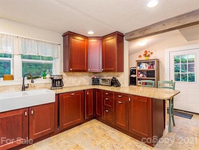 Quartz counters, big farmhouse sink, breakfast bar