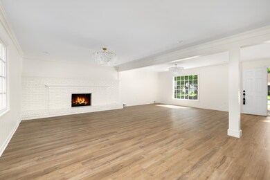 Unfurnished living room featuring light wood-type 