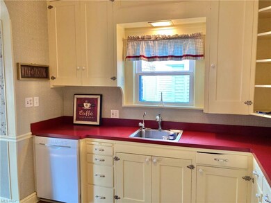 Remodeled kitchen with updated counters, dishwasher/disposal, gas range, refrigerator, LVT floors + more!Cabinets are Very Tall ~ Lots of Storage ~