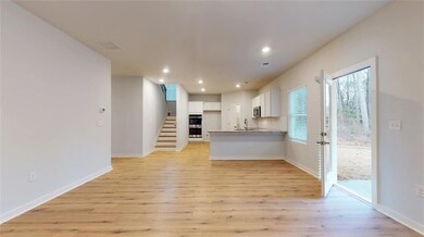Unfurnished living room with light wood-type floor