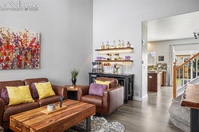 Living room featuring visible vents, baseboards, s