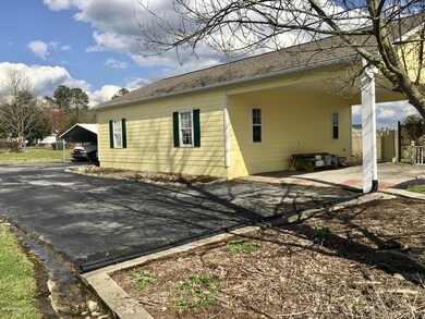 Workshop with attached carport