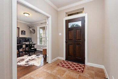 As you enter the foyer through a beautiful wood entry door you are greeted with a neutral paint palette.