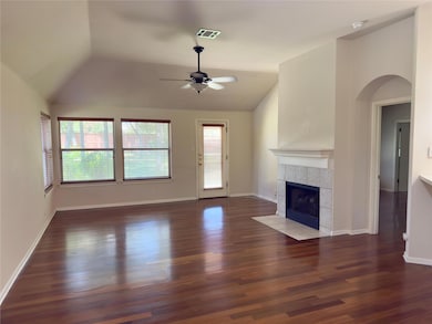 Unfurnished living room featuring vaulted ceiling