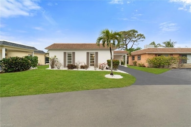 Single story home featuring a front yard
