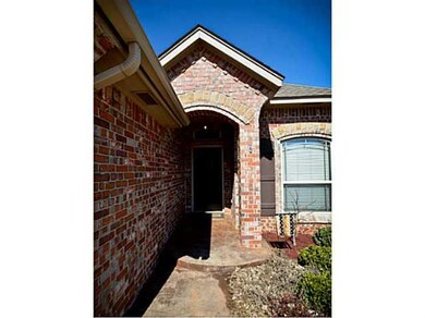 Exterior Front. Pretty landscaping and stained con