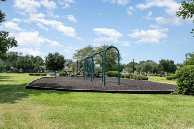 View of play area with a lawn