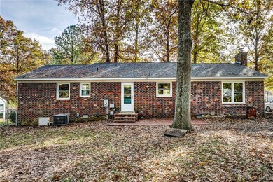Rear of home- new brick patio, enlarged double win