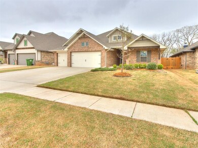View of front of home featuring fence, an attached