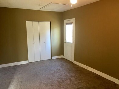 Looking from the kitchen into the bonus room.