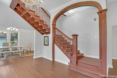 Spacious living area with awesome staircase, beaut