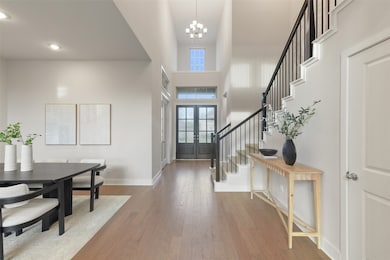 THE GRAND 2-STORY ENTRANCE HALL FEATURES HANDSOME