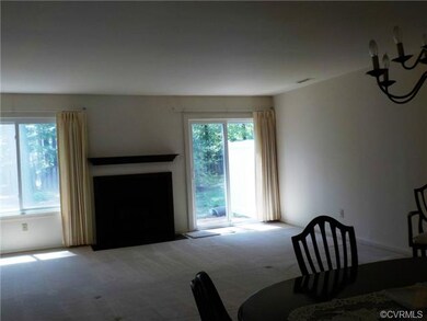 Living room with wood burning fireplace