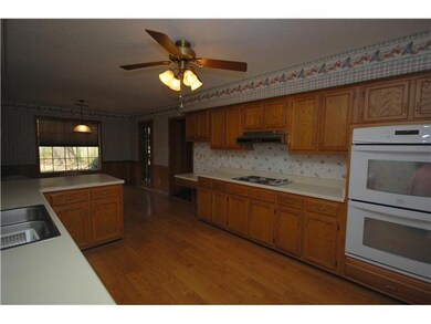 View to the breakfast room. Kitchen has double ove