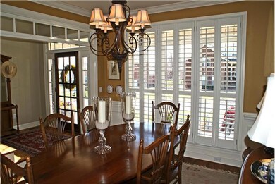 Formal dining room with beautiful plantation shutters.